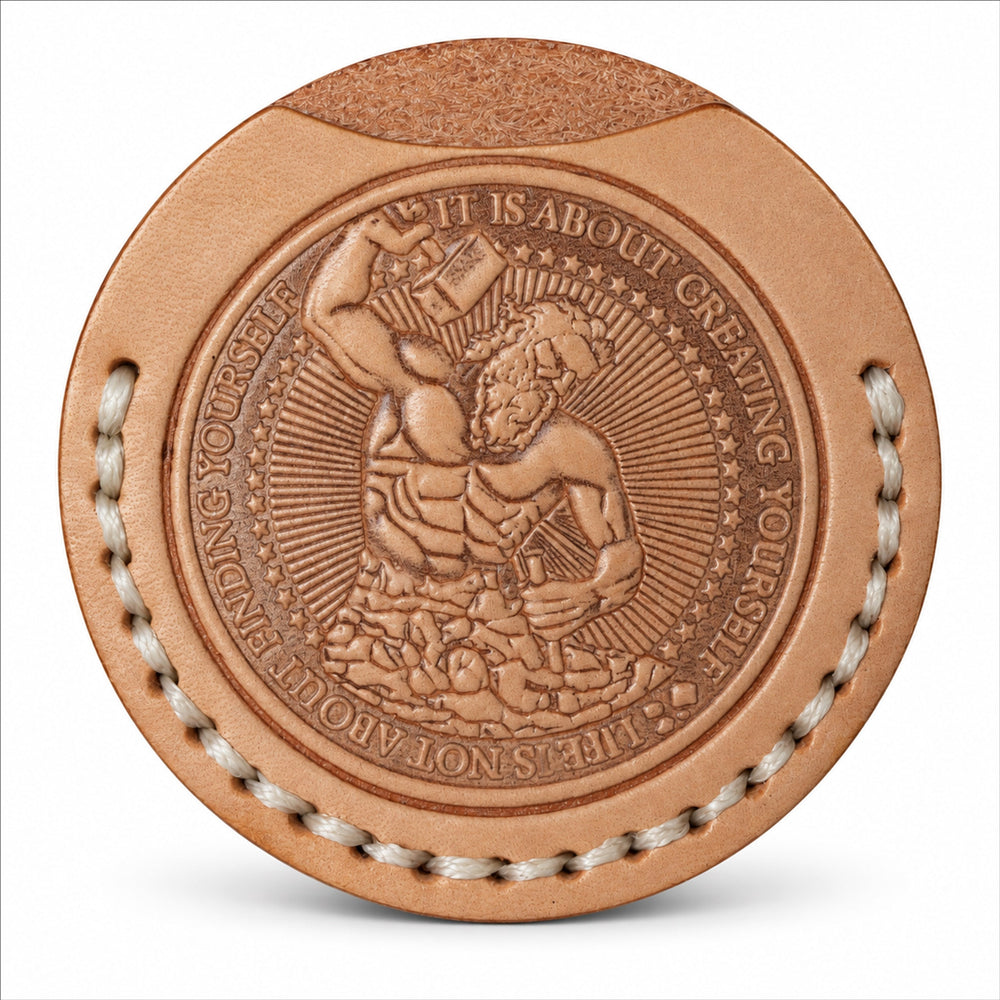 Metamorphosis natural tan leather coin sleeve embossed with a man sculpting himself from stone, a symbol of personal transformation